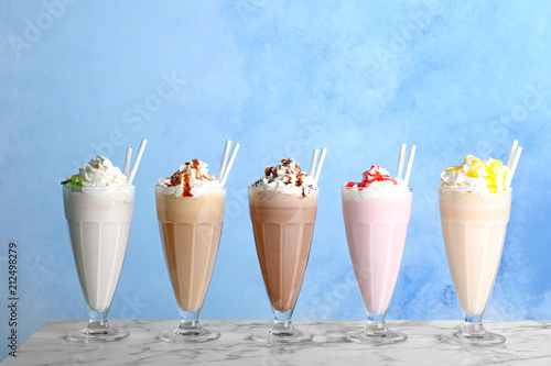 Wallpaper Mural Glasses with delicious milk shakes on table