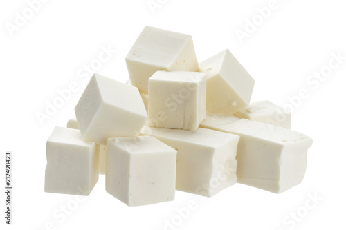 Heap of diced feta cubes isolated on white background