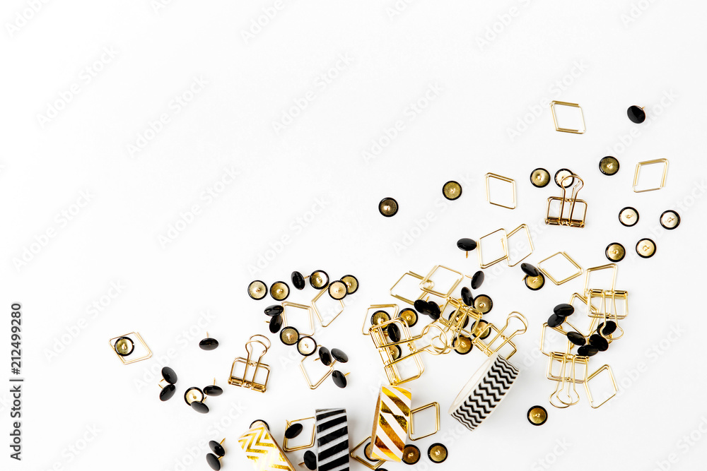 Fototapeta premium Various paper clips and pushpins on white background.