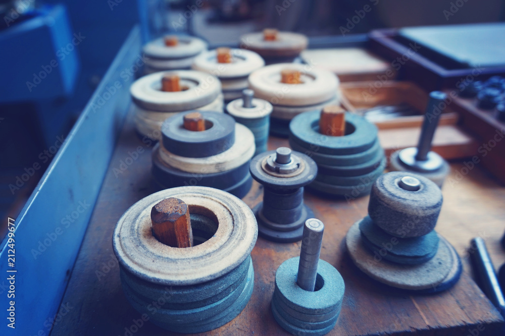 Abrasive grinding wheels on the rack are ready to work. Abrasive grinding wheels on the rack are ready to work.