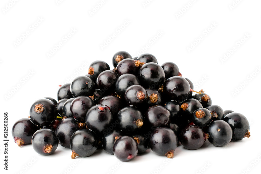 A bunch of black currants on a white background, close-up. A bunch of black currants on a white background, close-up.