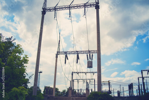 High-voltage wires on poles under high voltage. Tinted image. Power plants on the industry. photo