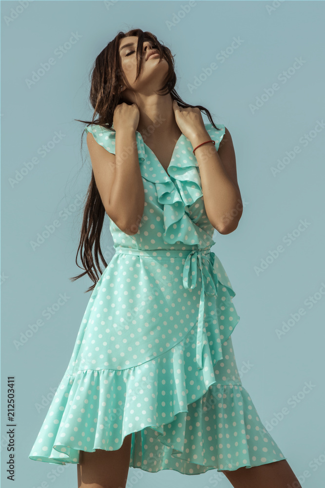 Female beauty girl model brunette in a dress on the mountain and dessert sand font Female beauty girl model brunette in a dress on the mountain and dessert sand font