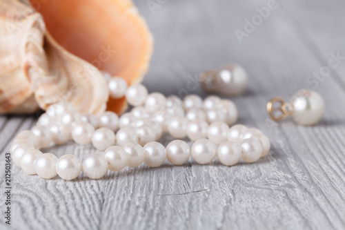 Wedding background with pearls and sea shell.