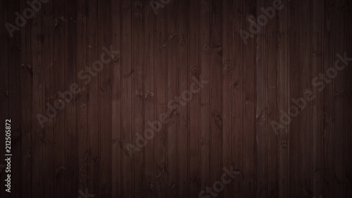 Dark old wooden fence as a background texture