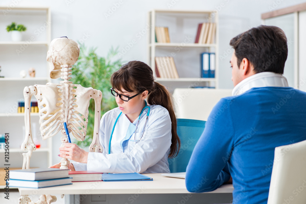 Fototapeta premium Doctor is explaining to patient with neck injury
