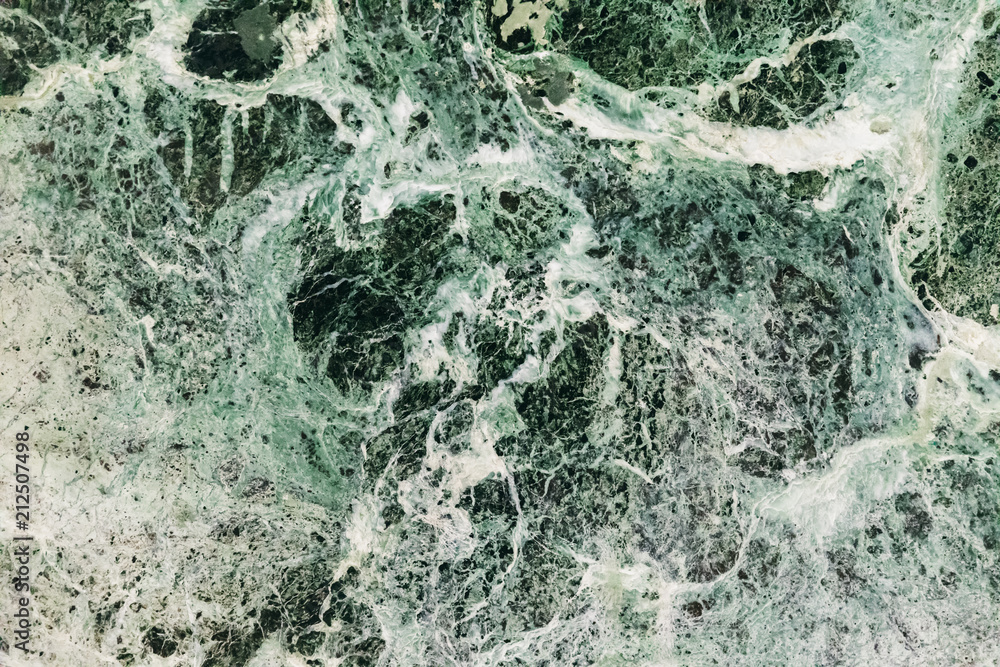 Fototapeta premium Marble green emerald background, beautiful stains and patterns