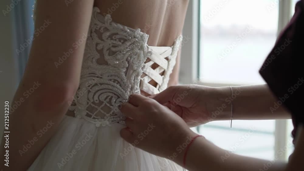 Bride wearing wedding bridal dress Bride wearing wedding bridal dress
