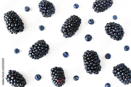 Styled stock photo. Summer healthy fruit composition with juicy blackberries and blueberries isolated on white table background. Food pattern. Empty space. Closeup Flat lay, top view.
