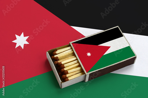 Jordan flag  is shown in an open matchbox, which is filled with matches and lies on a large flag photo