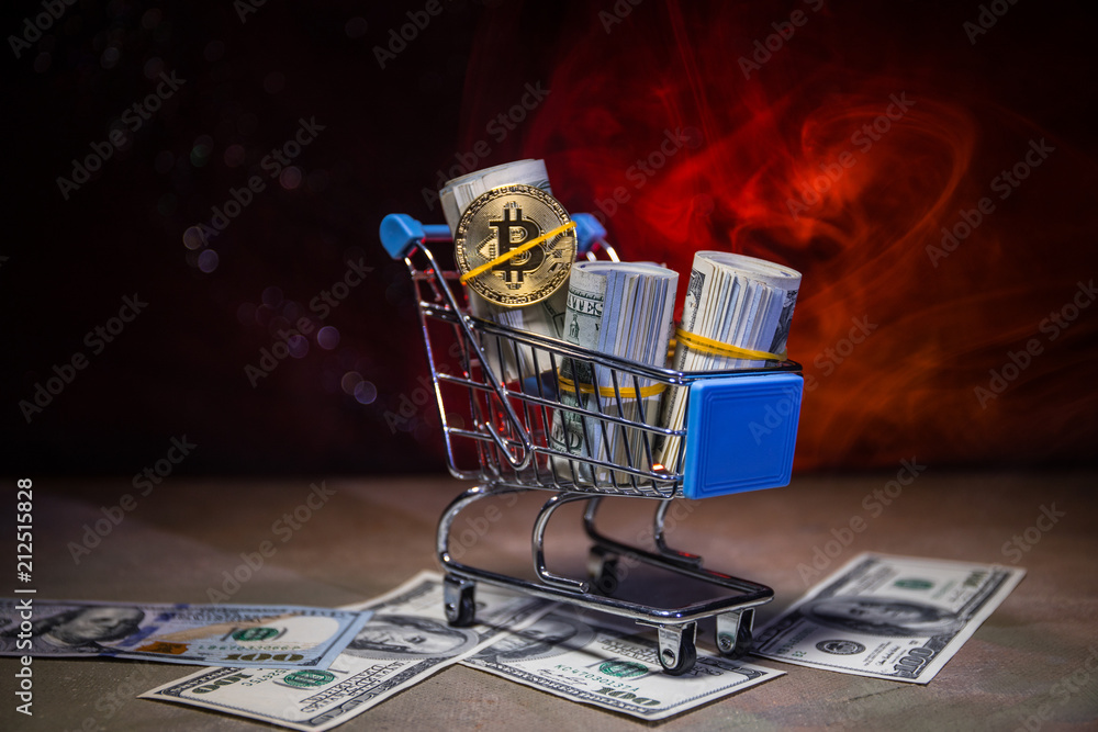 close up view of little shopping trolley full of coins isolated on brown.Gold coins in shopping online cart isolated on brown background,Saving Money Concept. Shopping trolley or cart with coin