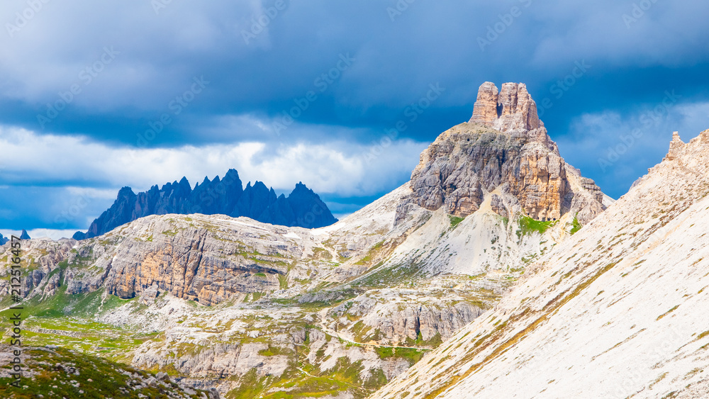Tre Cime Hut, aka Dreizinnenhutte or Rifugion Antonio Locatelli with Torre di Toblin, aka Toblinge Knoten, on the background, Dolomites, Italy.