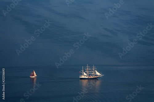 Two lonely sailboats in the middle of the sea. View from the plane.
 photo