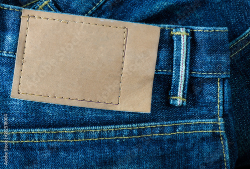 Foto jeans pants with back pocket and brown leather tag