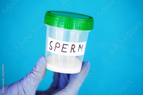 Health. Sperm Analysis. Concept of Bank Sperm. Infertility. Doctor's Hand Holding Container for Analyzes photo