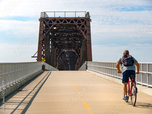Cyclist biking on urban city bike path in Louisville, Kentucky