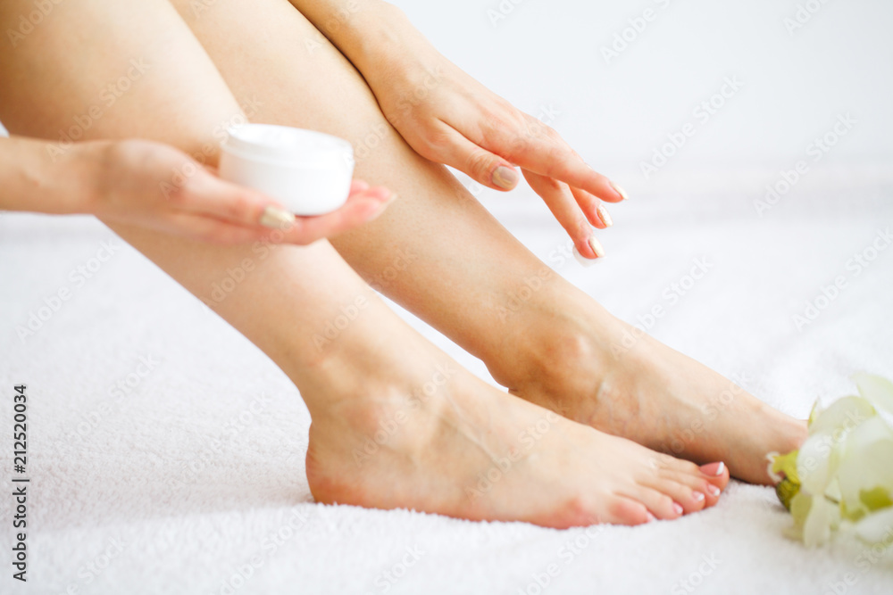 Fototapeta premium Hair Removal. Close Up Woman Hands Touching Long Legs, Soft Skin