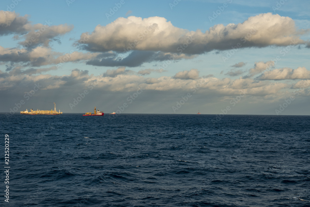 Beautiful day in the oil towers and offshore oil rigs, beautiful clouds, sea and sky, MORE OPTIONS IN MY PORTFOLIO 
