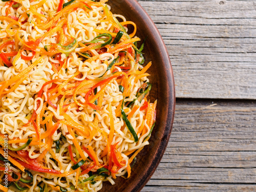 Asian noodles salad in bowl