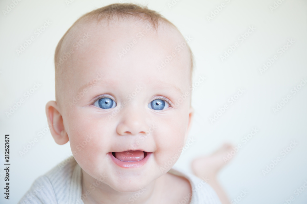 happy smiling child with blue eyes on white background