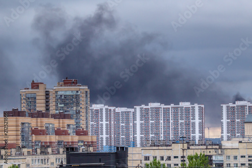 Black smoke over the city. Fire. Black smoke from home.