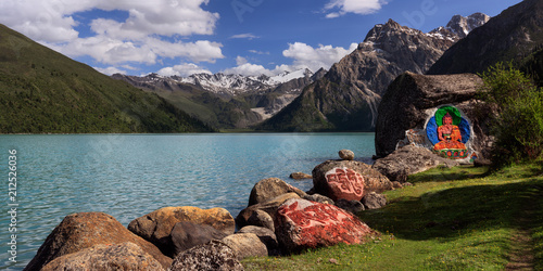 Xinluhai (Also known as Duopu Fairyland), Tibetan name Yulonglacuo. Beautiful high altitude lake above 4000 meters in Sichuan Province, China. Emerald and turquoise colored water and snow mountains. photo