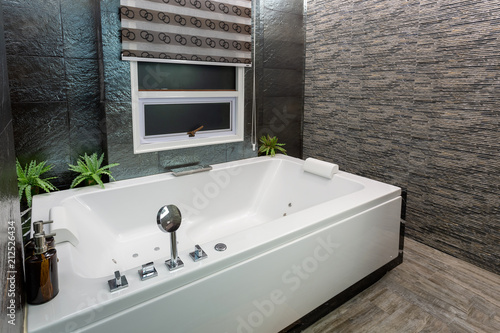 Modern grey bathroom with bathtub  3d rendering.