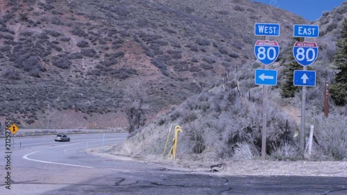 Interstate 80 signs east or west with blue arrows. photo