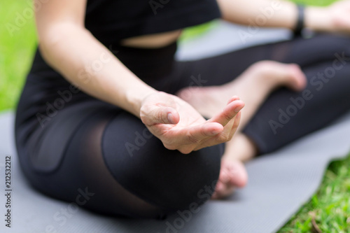 Young woman meditating in nature