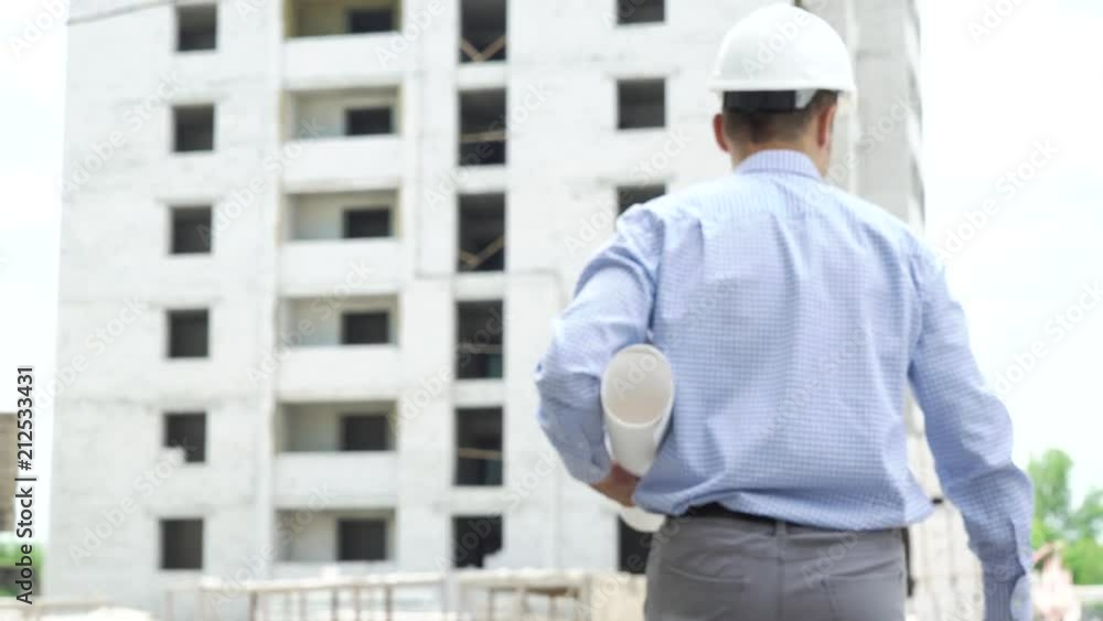 Group of men shaking hands at construction site. Business teamwork, cooperation, success, collaboration and safety concept Group of men shaking hands at construction site. Business teamwork, cooperation, success, collaboration and safety concept