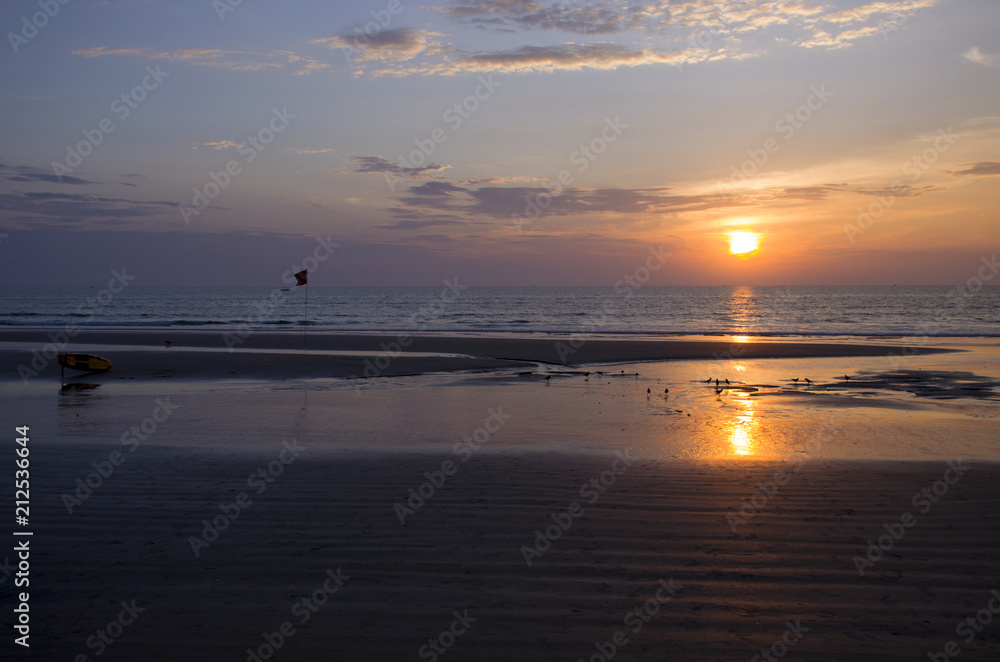 Beautiful landscape an orange sunset at the sea
