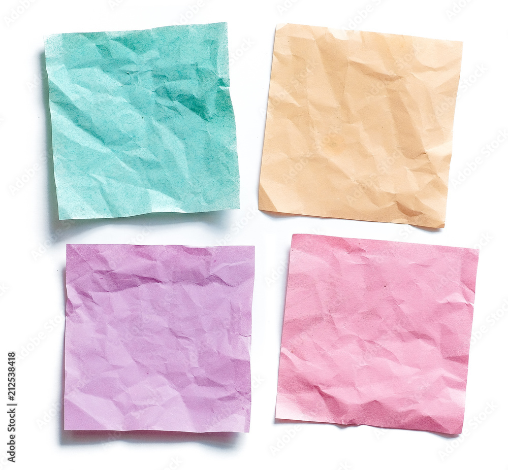 Obraz premium Four colored crumpled sticky note reminders