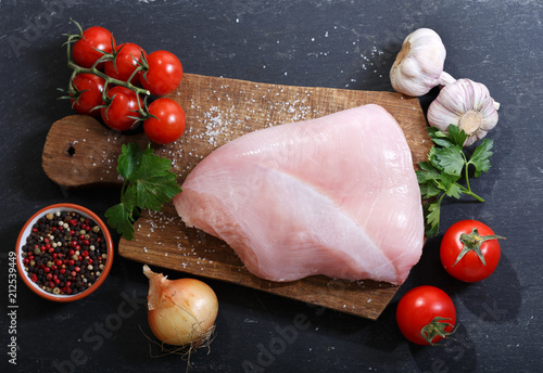 fresh turkey meat with ingredients for cooking