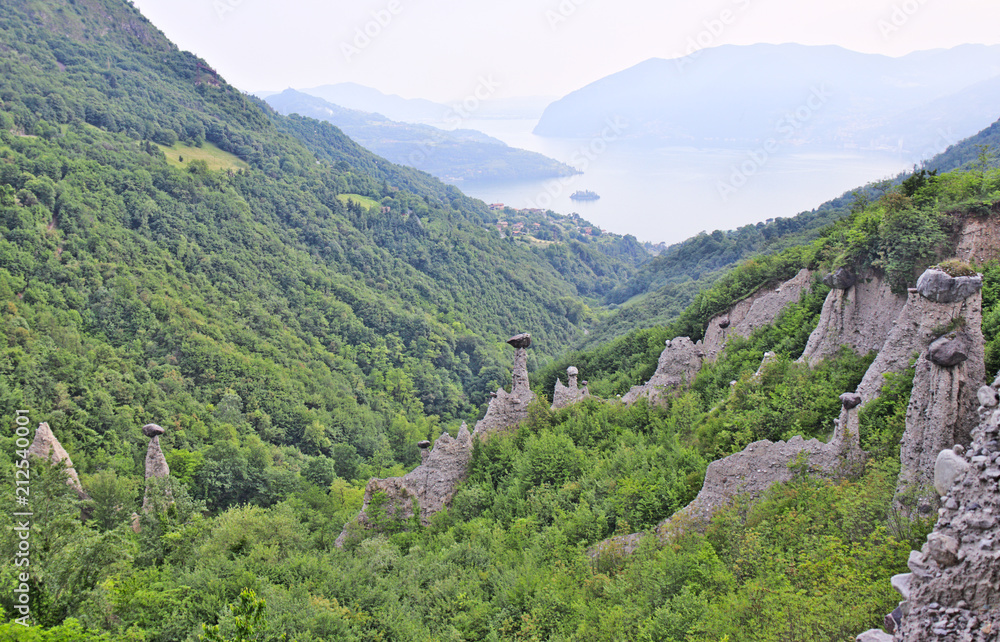 Zone Pyramids, unique form of geological erosion created an uncanny landscape of boulders perched atop slender columns of clay, near Iseo Lake, Lombardy, Italy