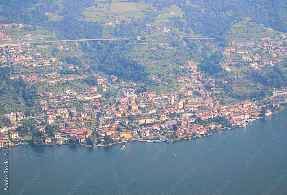 Iseo lake view, outdoor panorama on beautiful scenery, green hills and forests, sunny day, Lombardy, Italy