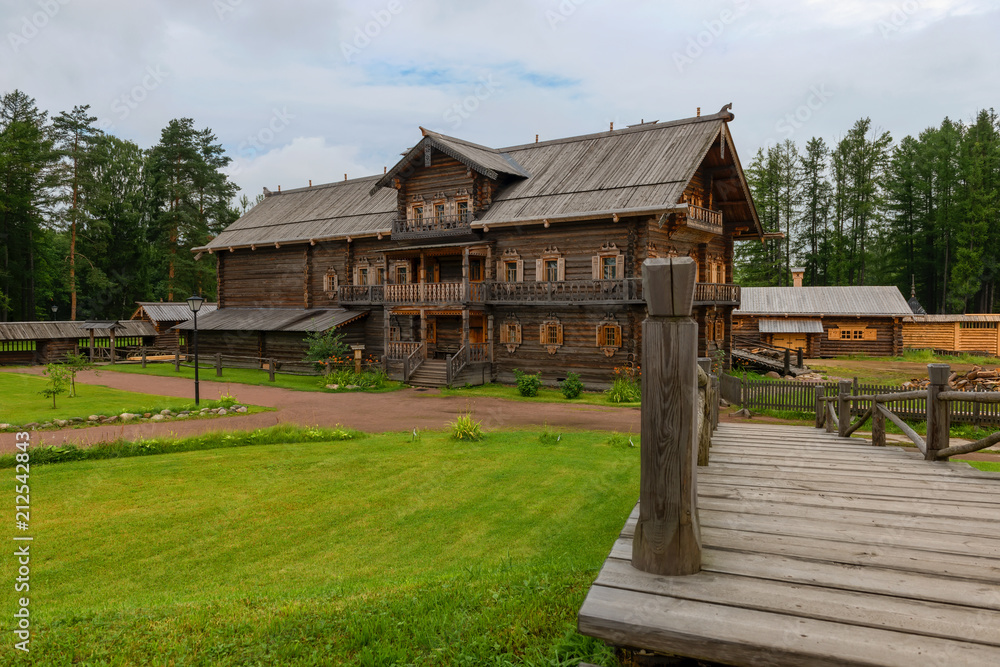 RUSSIA, SAINT PETERSBURG - AUGUST 18, 2017: The reconstructed house of merchant Kostin from Zaonezhye in the estate Bogoslovka. Building of 1871 RUSSIA, SAINT PETERSBURG - AUGUST 18, 2017: The reconstructed house of merchant Kostin from Zaonezhye in the estate Bogoslovka. Building of 1871