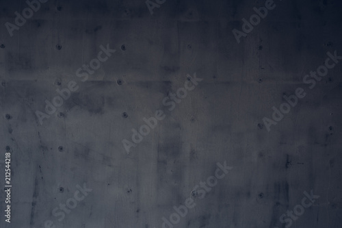 Dark gray rough surface of a concrete wall as a background texture