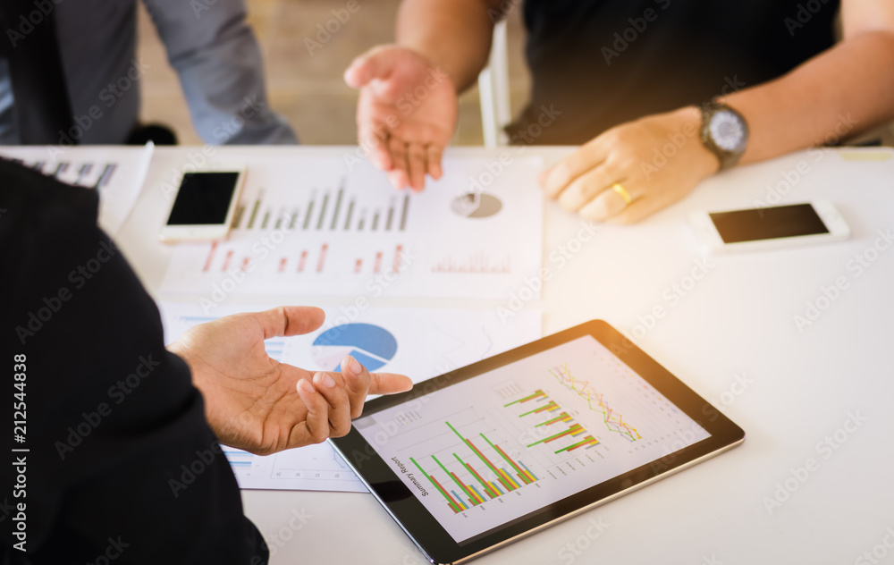 Manager and employee analyzing with tablet pc at business meeting with discussion working together. Manager and employee analyzing with tablet pc at business meeting with discussion working together.