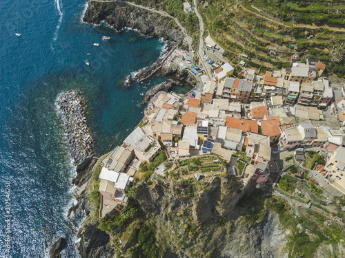 Manarola city. Rocky seashore. Cinca Terre. Italy photo