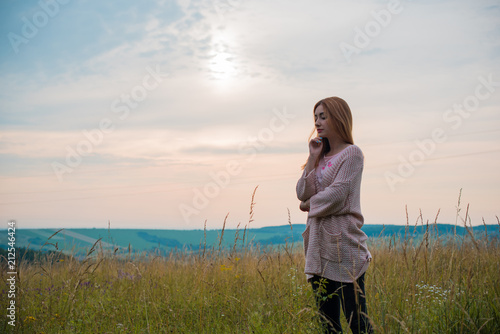 Travel concept, girl traveler looking at clouds and mountains, field. stylish hipster woman , atmospheric moment in adventure. Free lifestyle  © T.Den_Team