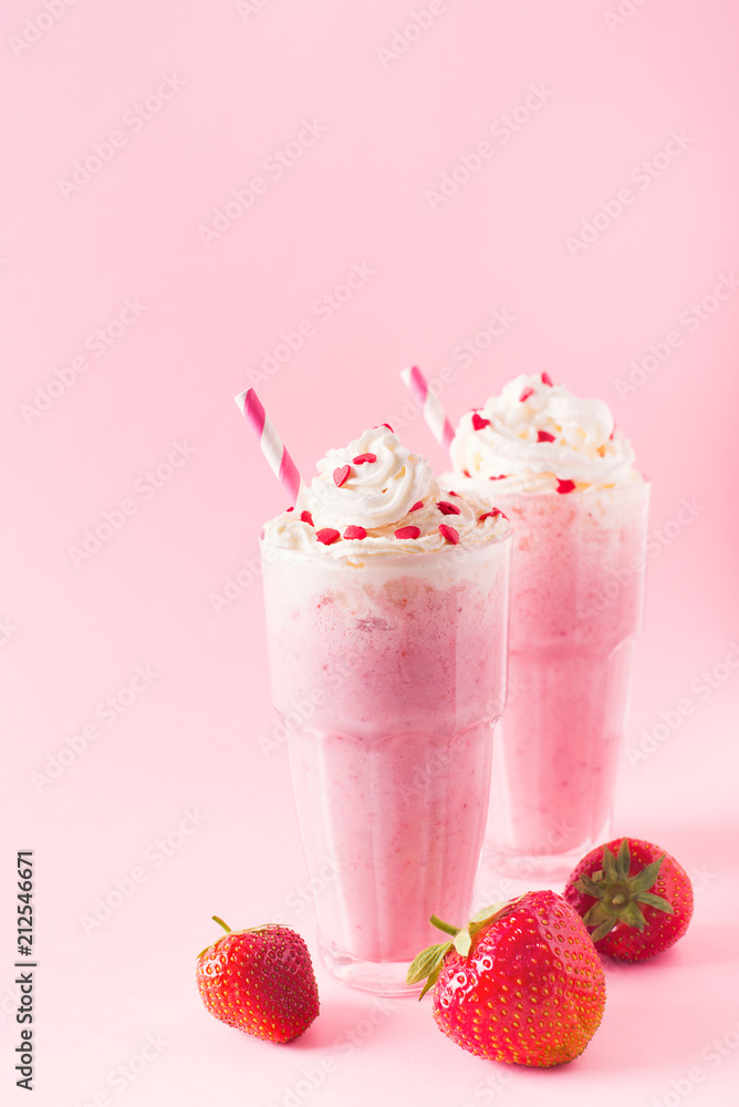Strawberry milkshake or smoothie and fresh raw berries Strawberry milkshake or smoothie and fresh raw berries