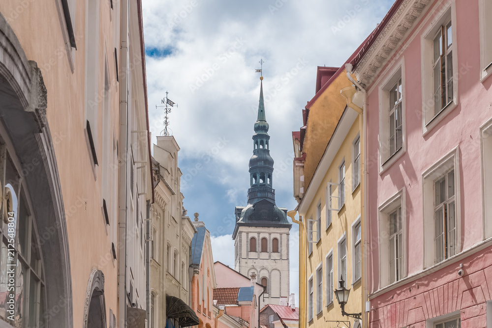 Tallinn in Estonia, panorama of the medieval city with St Nicolas church and colorful houses 
