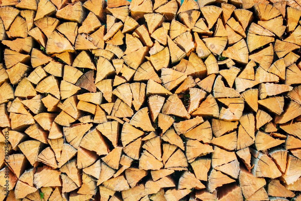 Stack of dry chopped firewood. Texture Stack of dry chopped firewood. Texture