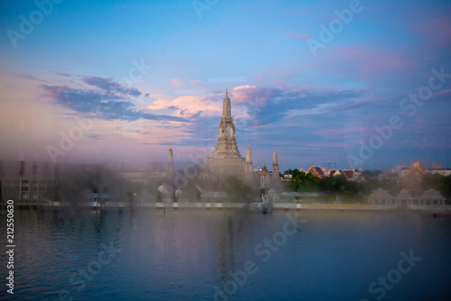 Wat Arun temple in Bangkok from stream window