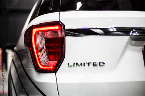 Rear stop light of large SUV car with Limited emblem