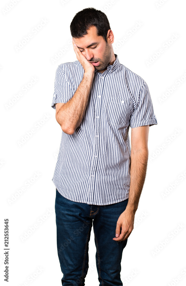 Handsome man making sleep gesture on isolated white background Handsome man making sleep gesture on isolated white background