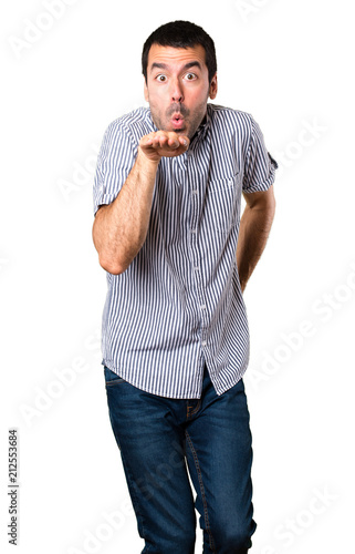 Handsome man dancing on isolated white background