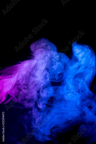 Red and blue smoke isolated on black background.