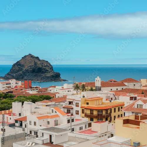 View of Garachico with Roque de Garachico, small island or roque located 300 meters of coast in Atlantic ocean. Tenerife village landscape background.