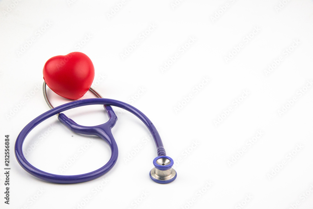 Red heart and a stethoscope on desk Red heart and a stethoscope on desk